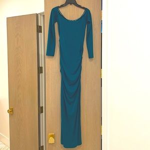 Nicole Miller Collection Stretchy material will fit size 2 through 6.